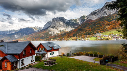 Fototapeta na wymiar Beautiful Alpine Landscape with green hills and Mountain Lake