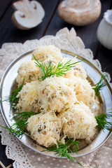 Salad with mushrooms in the form of balls in cheese, rafaello, selective focus