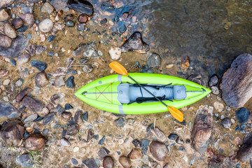 inflatable whitewater kayak on rocks aerial view