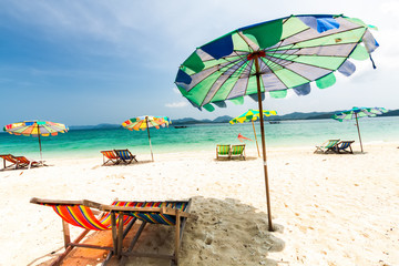 Colorful chairs and umbrella on tropical beach at Koh Khai Nok Island.Phuket Province.Thailand