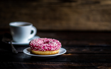 Pink donut with white sprinkle