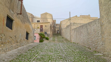 16464_A_wie_pathway_with_green_small_grasses_in_Erice_Trapani_in_Italy.jpg
