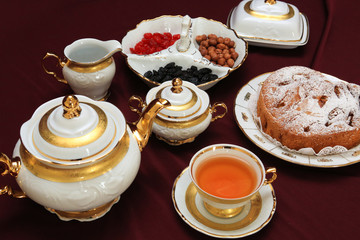 cup of tea and cakes on wooden table