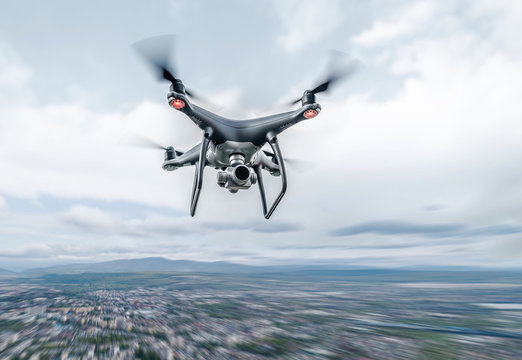 Dark drone in flight over the city.