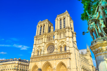 French architecture of Notre Dame cathedral of Paris, France. Beautiful sunny day in the blue sky....