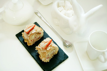 cake roll with strawberries isolated on white background