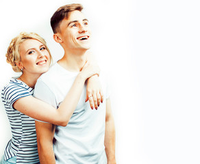 young pretty teenage couple, hipster guy with his girlfriend happy smiling and hugging isolated on white background, lifestyle people concept
