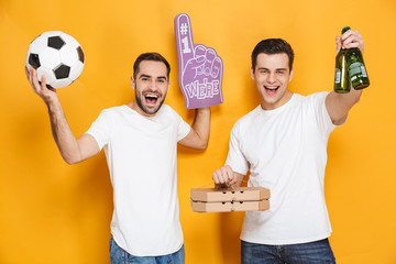 Image of two caucasian men supporter 30s in white t-shirts holding soccer ball and number one fan hand glove