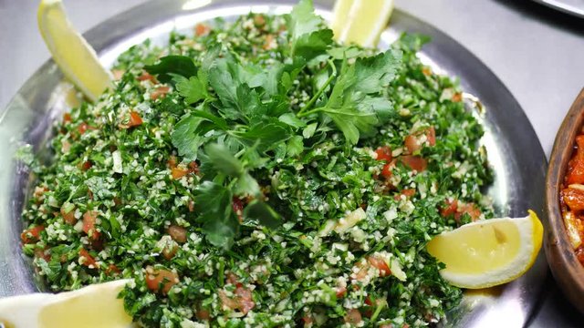 Millets Salad with Parsley Leaves, Green Dill, Slices of Tomato and Lemon