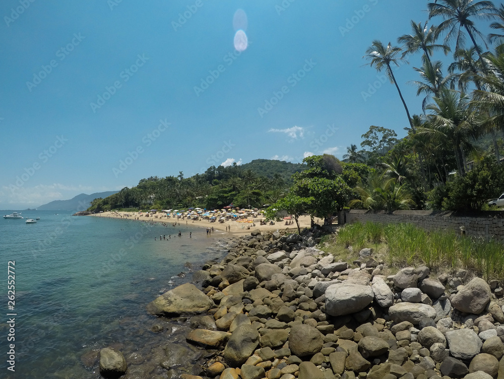 Sticker rocky coast and crowded beach