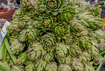 Fototapeta premium Display of artichoke's on sale at a market stall.