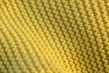 Artistic background from yellow knitted