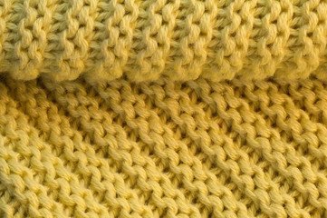 Artistic background from yellow knitted