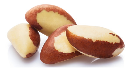 Naklejka na ściany i meble Delicious brazil nuts, isolated on white background