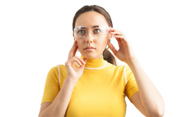 Young woman on white background with virtual holographic glasses