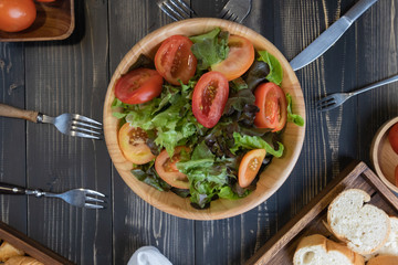 flat lay vegetable salad on bowl and bread