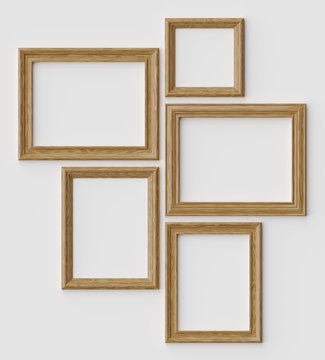 Wood picture or photo frames on white wall with shadows