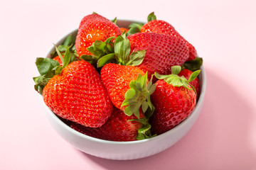 Fresh strawberries in ceramic bowl