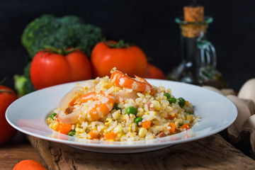 Seafood fried rice on wooden background，Thai Food ，Shrimp fried rice.