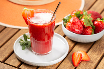 Sweet fresh strawberry smoothie. Leisure scene