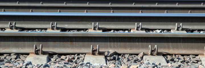 railway rails reflecting the sky