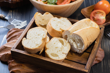 close up of bread and green oak lettuce salad