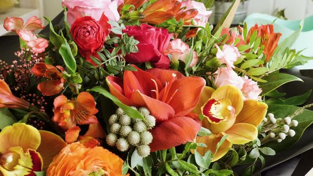 Close-up shot of a beautiful and stylish bouquet of fresh various flowers in floral design studio, flower shop. 4K