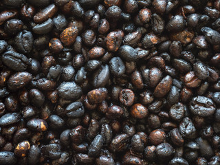 Grains of roasted Cuban coffee in a pan. 