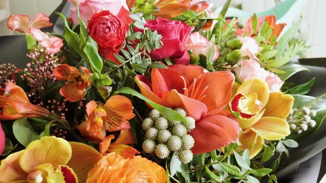 Close-up shot of a beautiful and stylish bouquet of fresh various flowers in floral design studio, flower shop. 4K