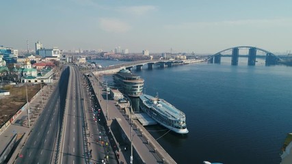 Marathon running along seafront at morning.