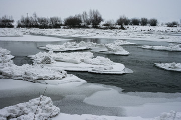 Ice floes and ice islands in the river Mures, close to the city of Targu Mures in Transylvania, Romania.
