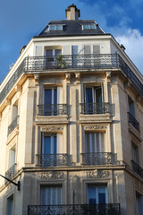 Traditional French house with typical balconies and windows. Paris.