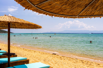 Ammolofoi Beach, Kavala Region, Northern Greece as seen from beneath a beach umbrella