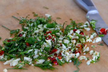 Fresh chopped spices with garlic, red chilli peppers, green fennel