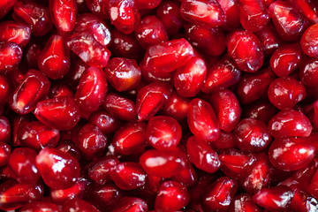 Fresh pomegranate seeds for food background. Texture from pomegranate seeds. Top view.