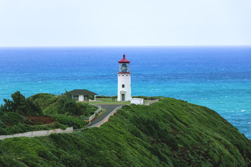 Fototapeta na wymiar Lighthouse with Blue Ocean in Background 