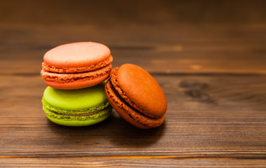 Cake macaron or macaroon on background, colorful almond cookies, pastel colors, vintage card