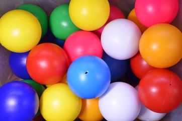 Obraz premium Plastic colored children's balls. Bright round balls for children's pools and games