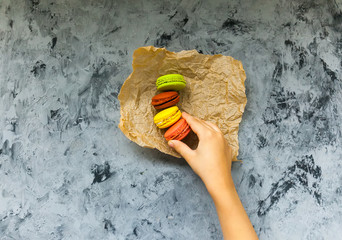 Cake macaron or macaroon on background, colorful almond cookies, pastel colors, vintage card