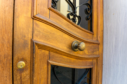 Brass doorknob on vintage wooden door