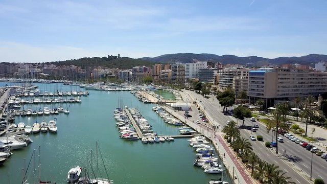 Coastline and Port of Palma de Mallorca Aerial footage of boats, yachts and busy streets in the port of Palma de Mallorca, Spain.