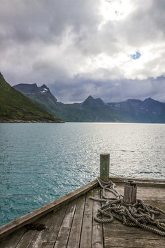 clouds over the fjord on Senja island in Norway © tmag