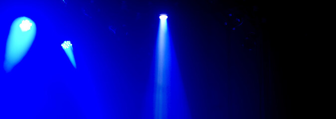 Blue abstract spotlight ambient stage light dark light background banner with blank space