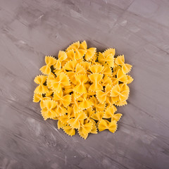 Simple homemade pasta cooking farfalle and dish ingredients - obrazy, fototapety, plakaty
