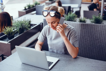 Pretty Young Beauty Woman Using Laptop in cafe, outdoor portrait business woman, hipster style,...
