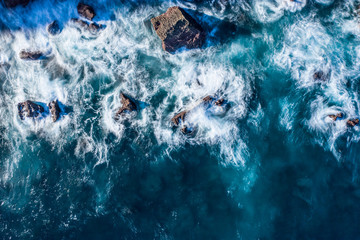 Blur of sea waves colors breaking in the coast of Lekeitio, Basque country - drone aerial view, long exposure