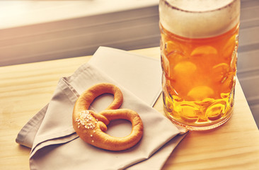 Sausages with potatoes and Pretzels Bavarian with a beer 