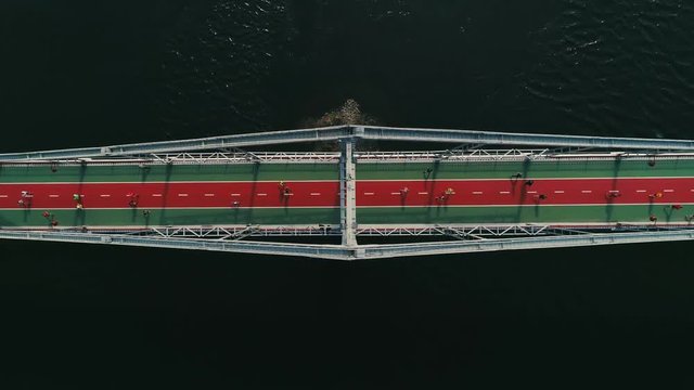 Marathon running on the footbridge. Top view shot