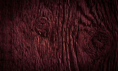 Texture of dark burgundy old rough wood. Mahogany abstract background for design. Vintage retro