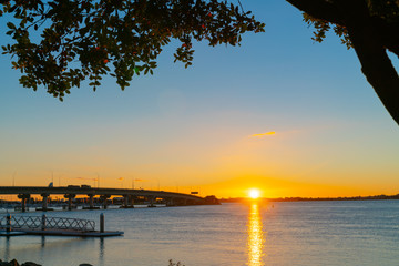 Sunrise  glows across harbor